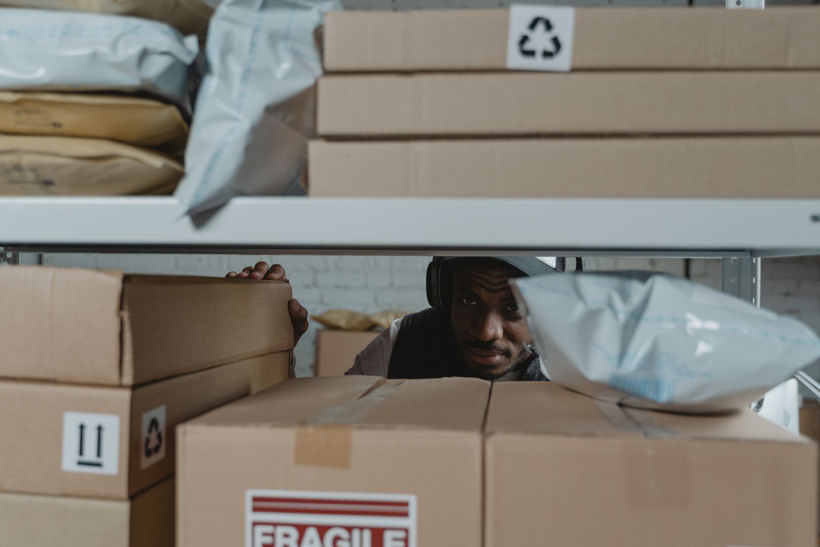 Warehouse operator inspecting parcel inventory